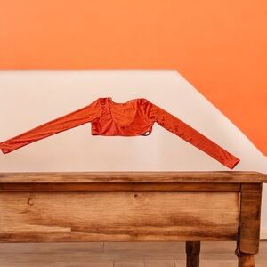 DOLLS KILL ORANGE LONG SLEEVE CUTOUT CROP TOP - SIZE SMALL